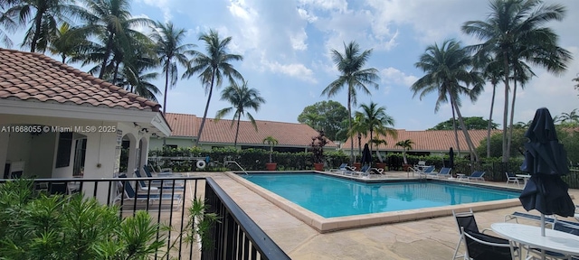 pool featuring a patio and fence