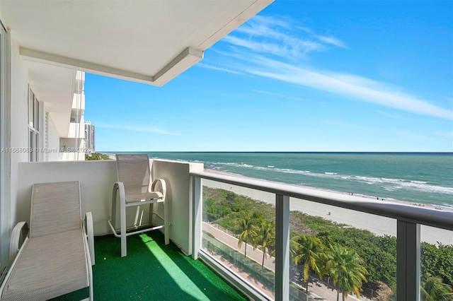 balcony with a view of the beach and a water view