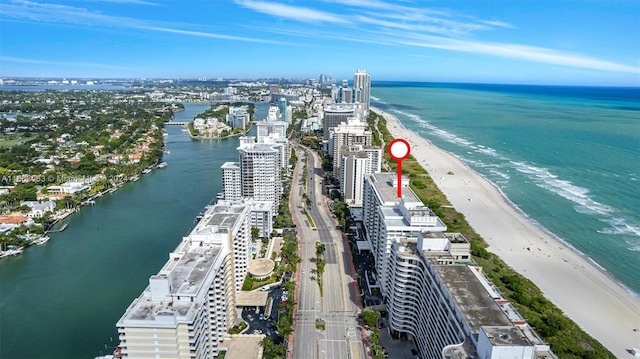 aerial view featuring a water view and a beach view