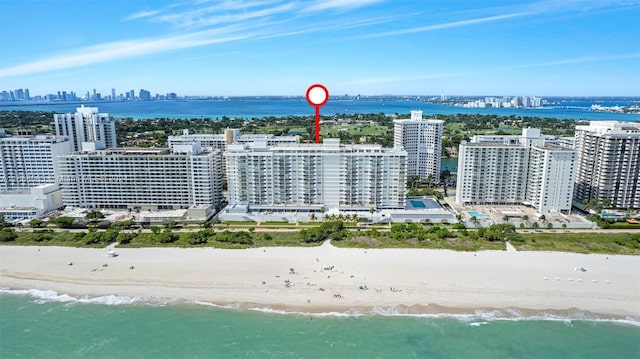 bird's eye view with a water view and a view of the beach