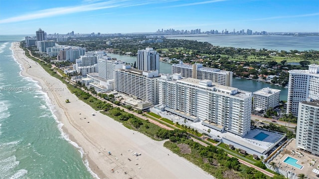 bird's eye view with a beach view and a water view