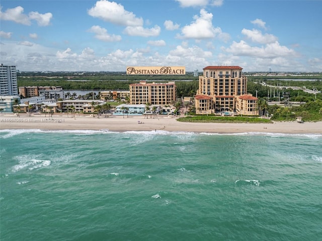 bird's eye view with a view of the beach and a water view