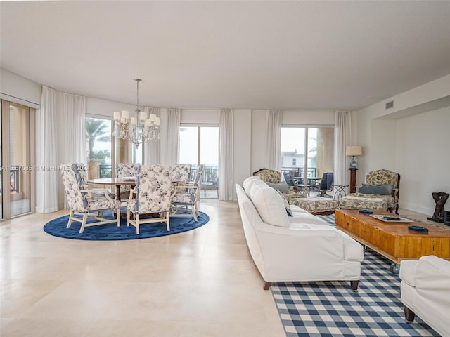 living room featuring a notable chandelier and plenty of natural light