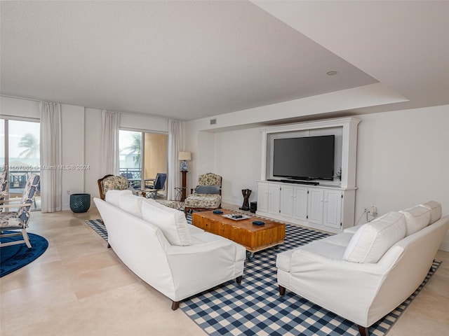 living room featuring a textured ceiling