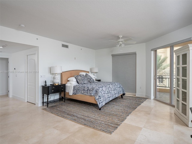 bedroom with ceiling fan, a textured ceiling, and access to exterior