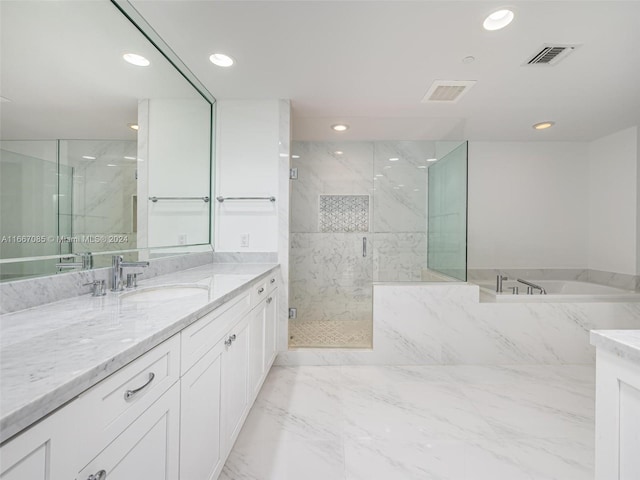 bathroom featuring vanity and separate shower and tub