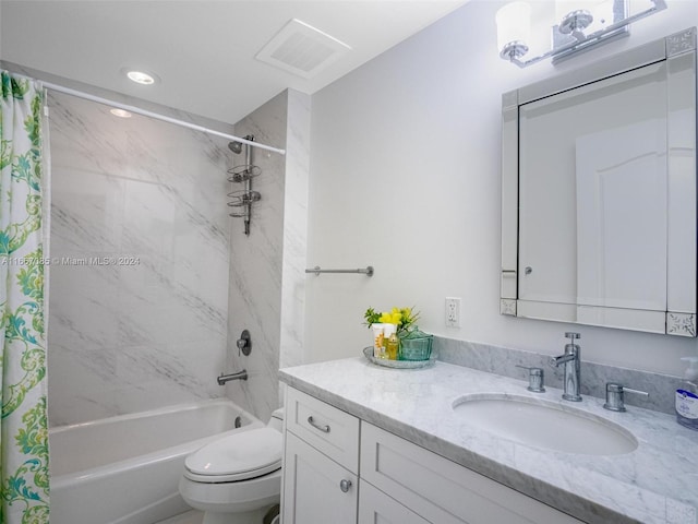 full bathroom featuring vanity, toilet, and shower / tub combo with curtain