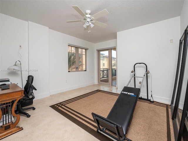 office with a textured ceiling and ceiling fan