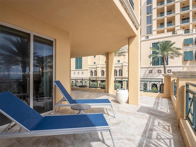 view of patio featuring a balcony