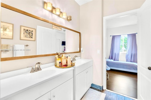 bathroom featuring vanity and wood-type flooring