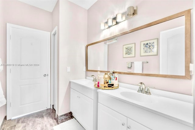 bathroom featuring vanity and hardwood / wood-style floors