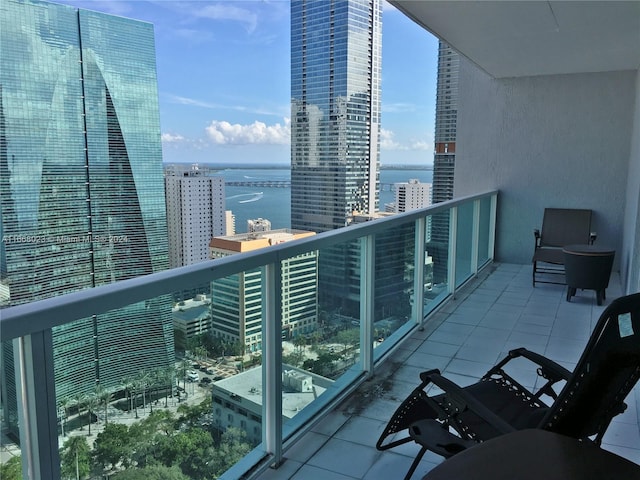 balcony featuring a water view