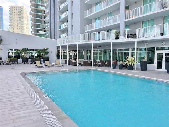 view of swimming pool with a patio area