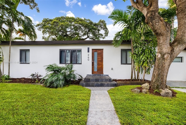 view of front of home with a front yard