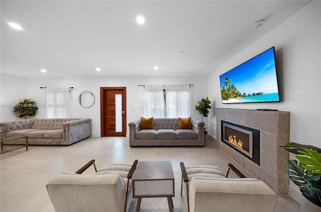 living room with a tiled fireplace