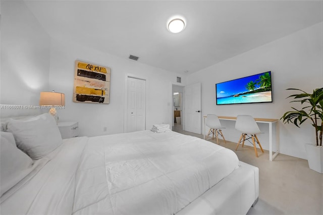 carpeted bedroom with a closet