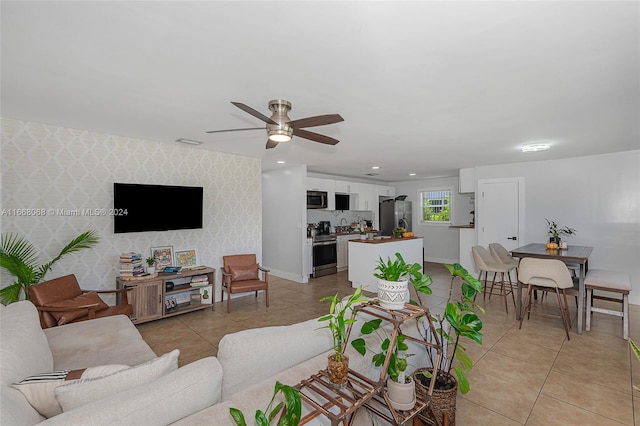 tiled living room featuring ceiling fan