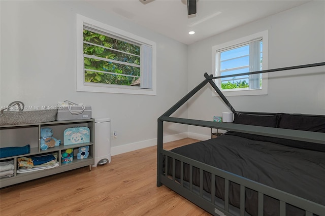 bedroom featuring ceiling fan and light wood-type flooring