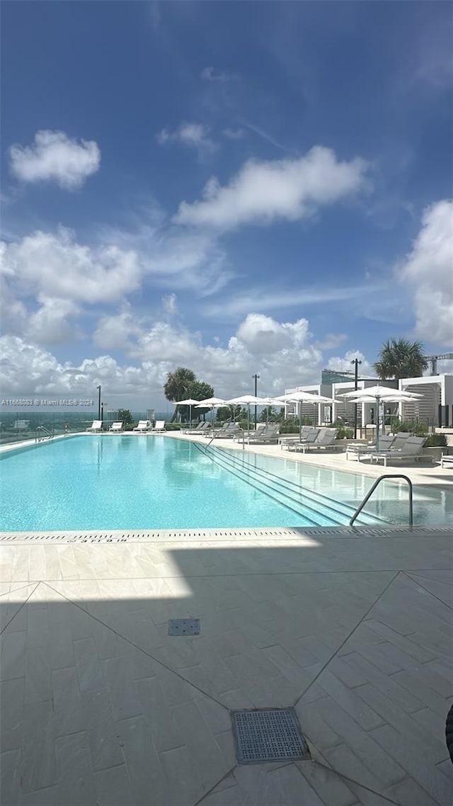 view of swimming pool featuring a patio area