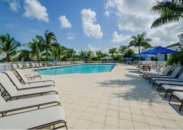 view of swimming pool with a patio area