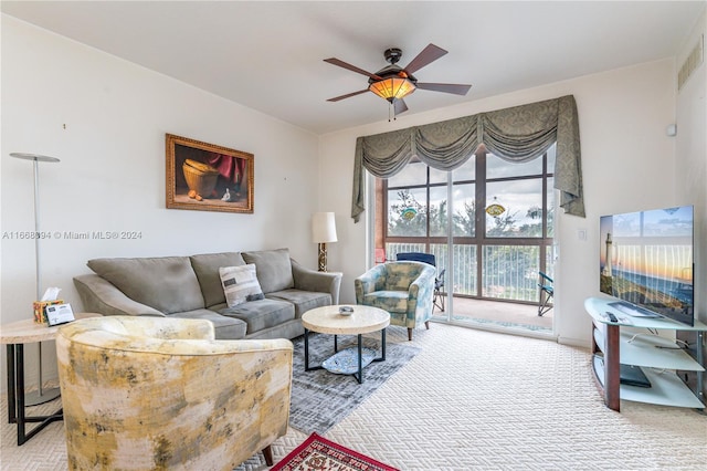 living room with ceiling fan and carpet floors