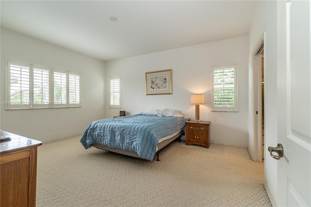 bedroom featuring light colored carpet