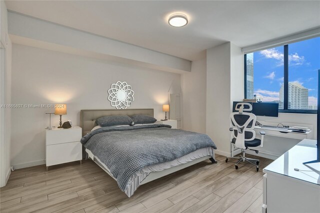 bedroom featuring light wood-type flooring