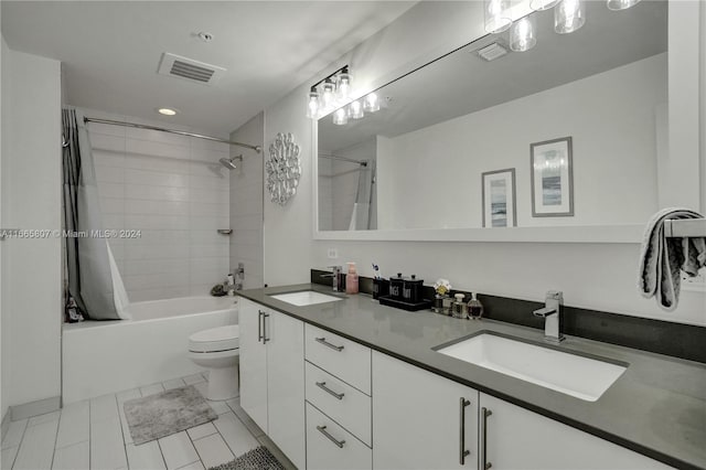 full bathroom featuring tile patterned flooring, shower / bath combo, vanity, and toilet