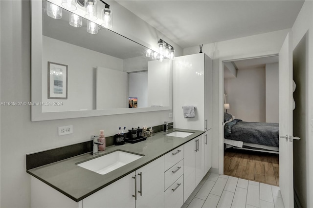 bathroom featuring wood-type flooring and vanity