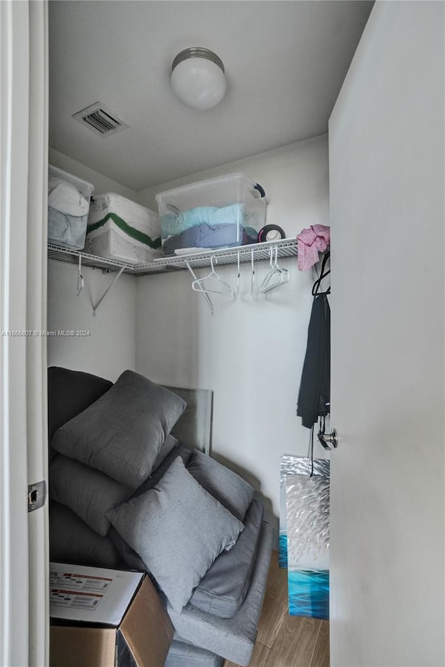 walk in closet featuring hardwood / wood-style floors