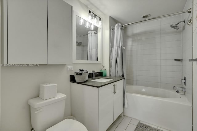 full bathroom featuring tile patterned floors, shower / bath combo, vanity, and toilet