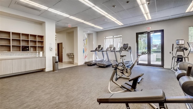 workout area featuring carpet and french doors