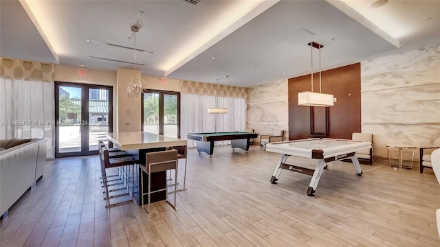 playroom with pool table, light hardwood / wood-style flooring, and french doors