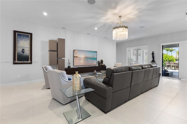 tiled living room featuring a notable chandelier