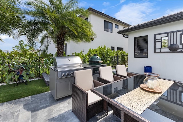 view of patio with an outdoor kitchen and area for grilling