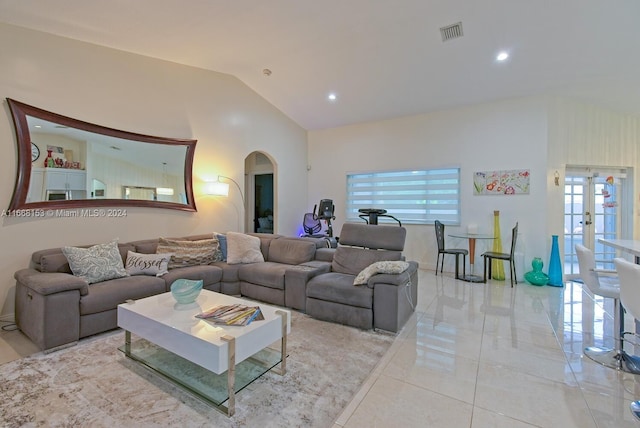 living room with french doors and vaulted ceiling