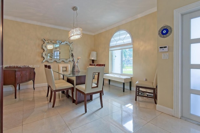 tiled dining area with a notable chandelier and crown molding