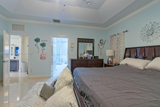 bedroom featuring ensuite bathroom, a raised ceiling, and ornamental molding