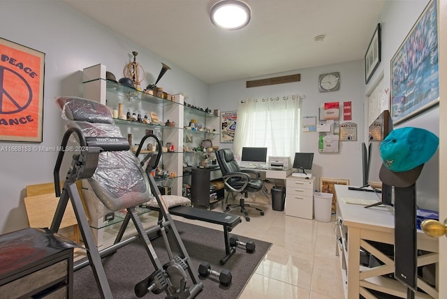 workout room featuring light tile patterned floors