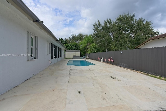 view of swimming pool with a patio area