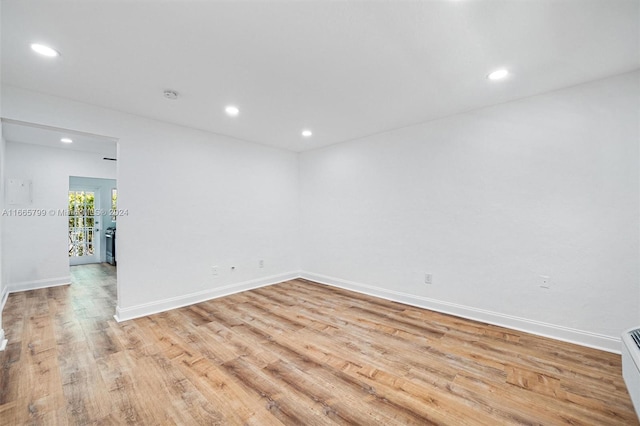 unfurnished room with light wood-type flooring