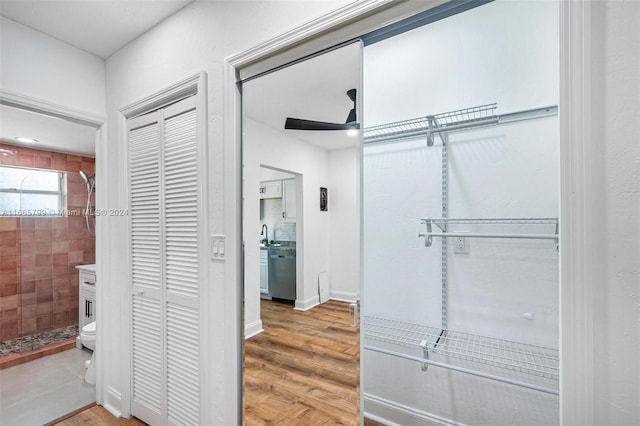 interior space with wood-type flooring and ceiling fan