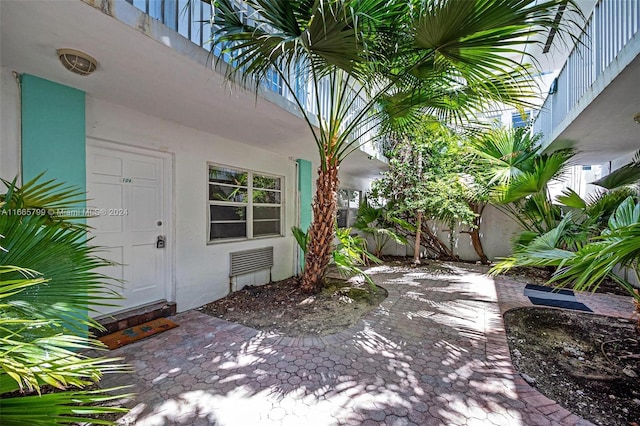 doorway to property featuring a patio area