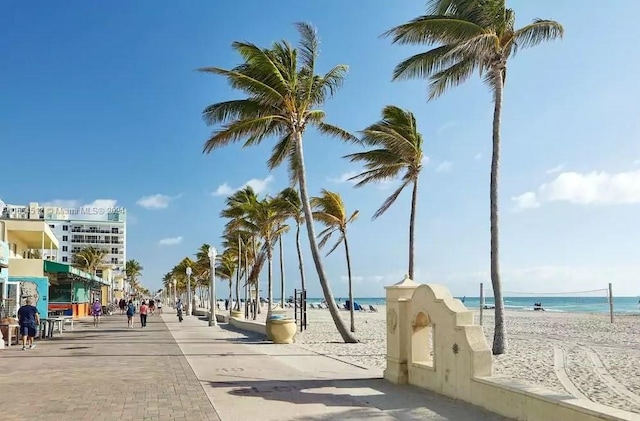 exterior space featuring a view of the beach and a water view