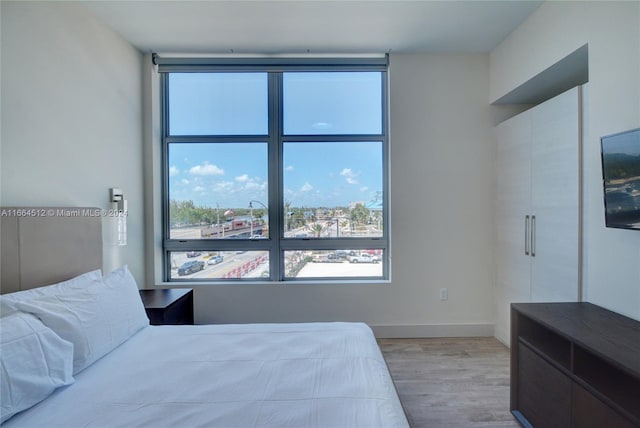 bedroom with light hardwood / wood-style flooring