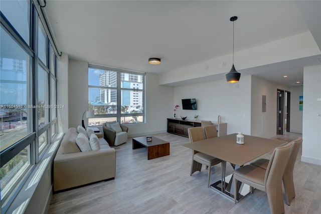 dining area with light wood-type flooring