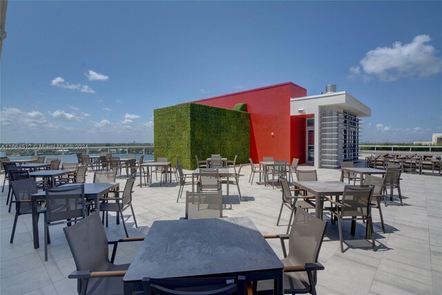 view of patio with a water view