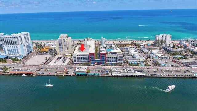 birds eye view of property featuring a water view