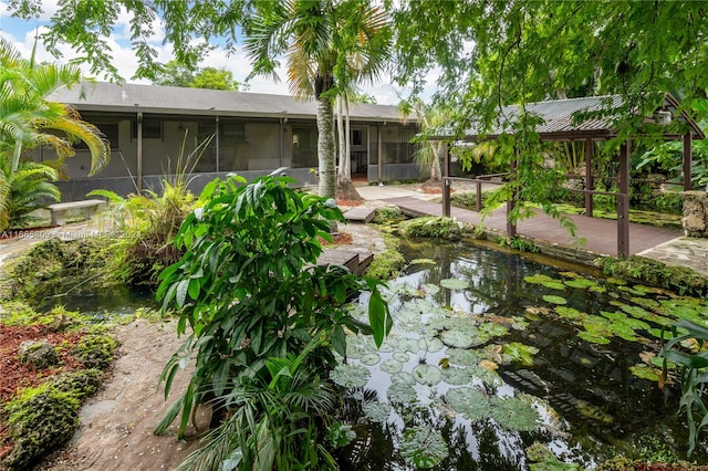 view of yard with a patio area and a sunroom