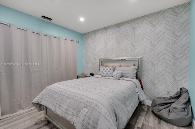 bedroom with light wood-type flooring